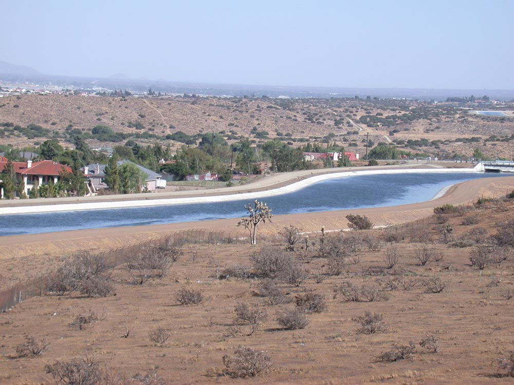 Houses Below the Concrete&nbsp;River