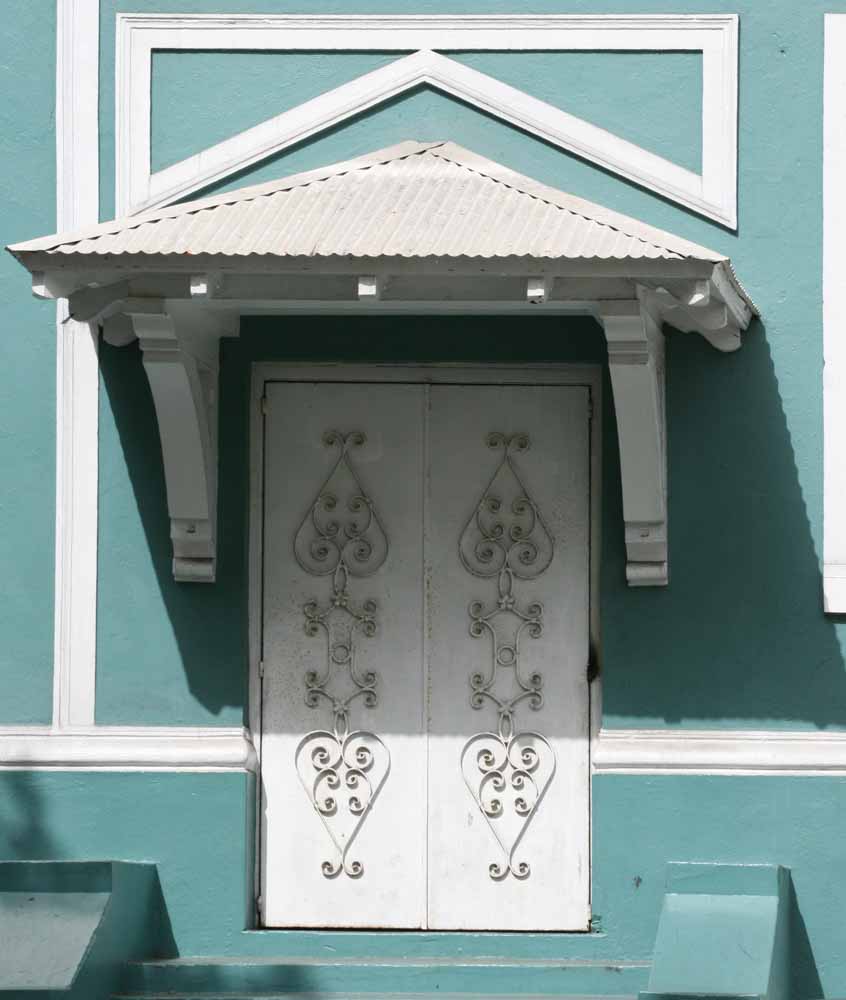 Teal Door photographing doors. The intense sun